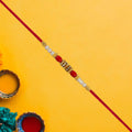 Pearl Beaded Rakhi – Traditional Red & Gold Elegance (pack of 10)