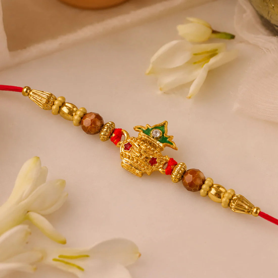 Golden Kalash Rakhi – Elegant Moti Design for Brother