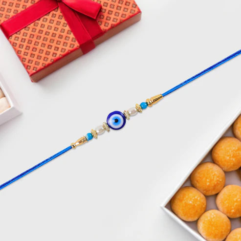 Blue Rakhi – Elegant Stone & Pearl Design for Brother