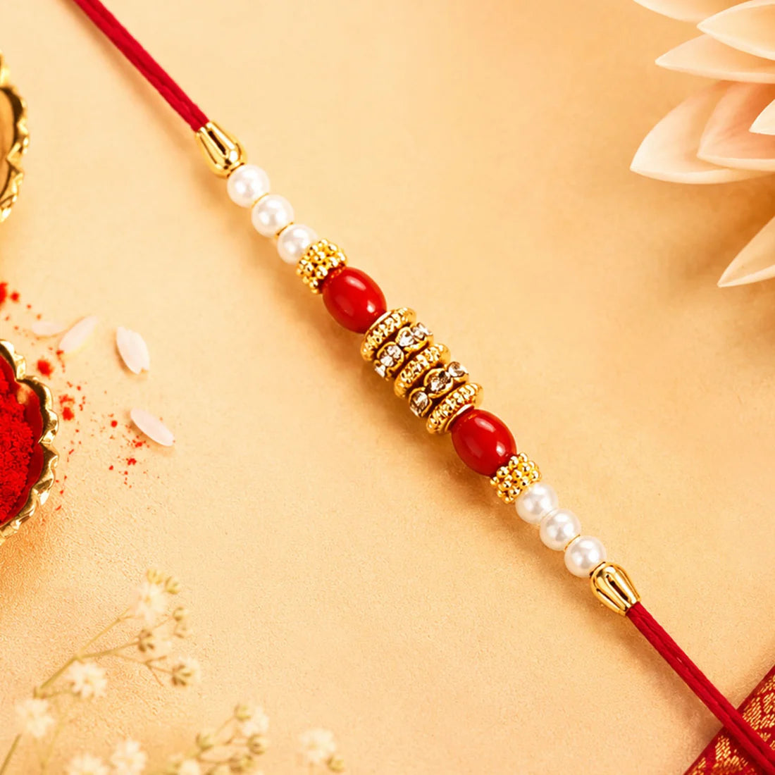 Pearl Beaded Rakhi – Traditional Red & Gold Elegance (pack of 10)