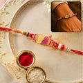 Designer Rakhi with Beads & Pearl Detail – Elegant & Festive