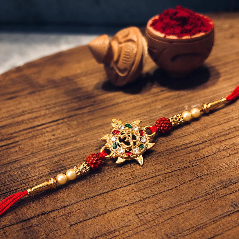 Divine Om Symbol Rakhi – Elegant Stones & Spiritual Design (pack of 10)